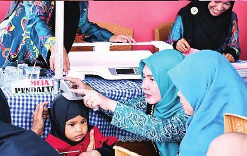 BARITO SELATAN TEKAN STUNTING: Ketua TP-PKK Barito Selatan Hj. Permana Sari saat menghadiri kegiatan sosialisasi di Aula Kantor Kecamatan Dusun Selatan, Buntok, belum lama ini.